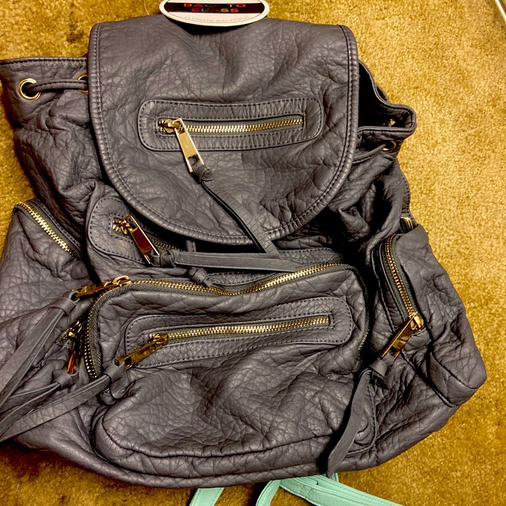 Under one sky leather backpack